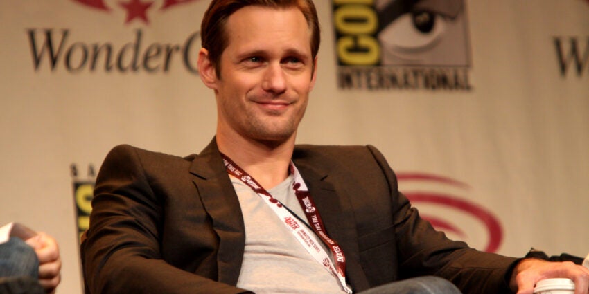 Actor Alexander Skarsgard sitting at an event, looking out into the audience