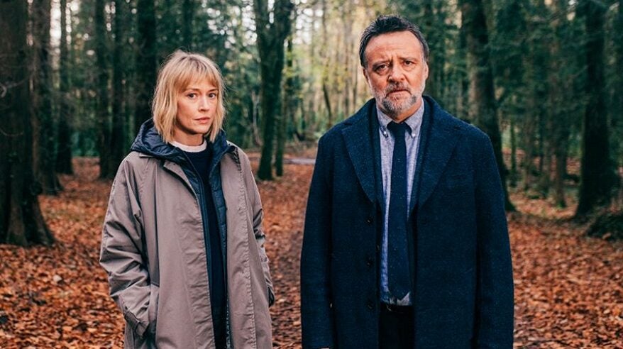 Elen Rhys and Richard Harrington in Welsh drama Cleddau, standing in a wood