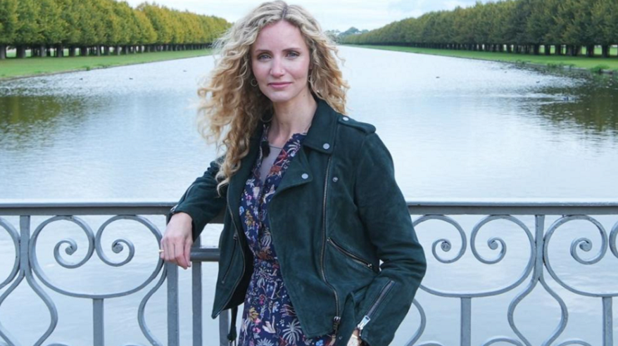 Historian Suzannah Lipscomb on a bridge with river in the background