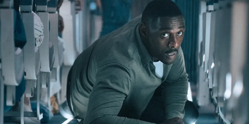 Idris Elba in Hijack, lying on the floor of an aircraft