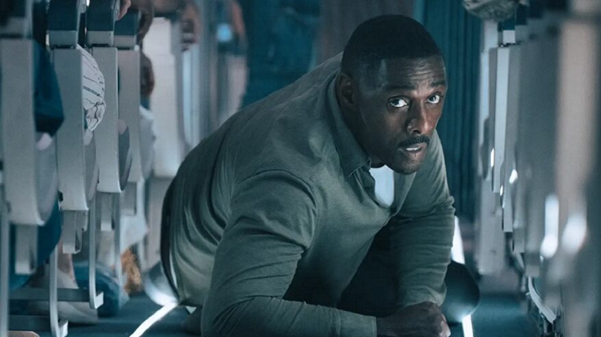 Idris Elba in Hijack, lying on the floor of an aircraft