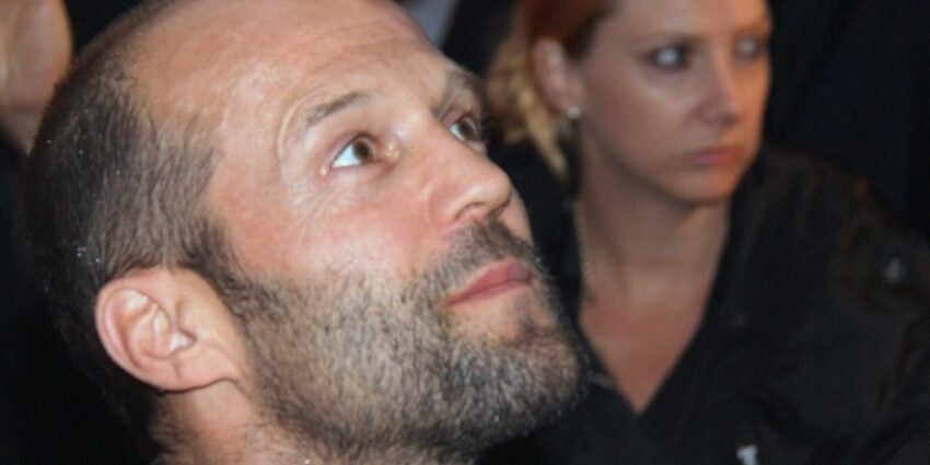 Actor Jason Statham looking upwards