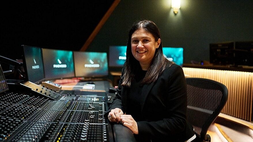 Culture Secretary Lisa Nandy sitting at a post-production desk at Pinewood Studios