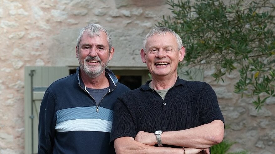 Actors Neil Morrissey and Martin Clunes outside a French house