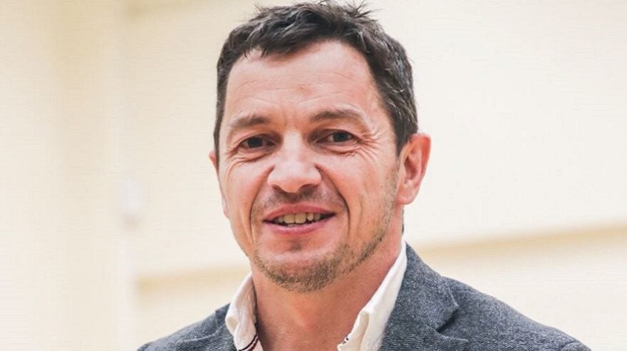 Headshot of Geraint Evans in shirt and jacket