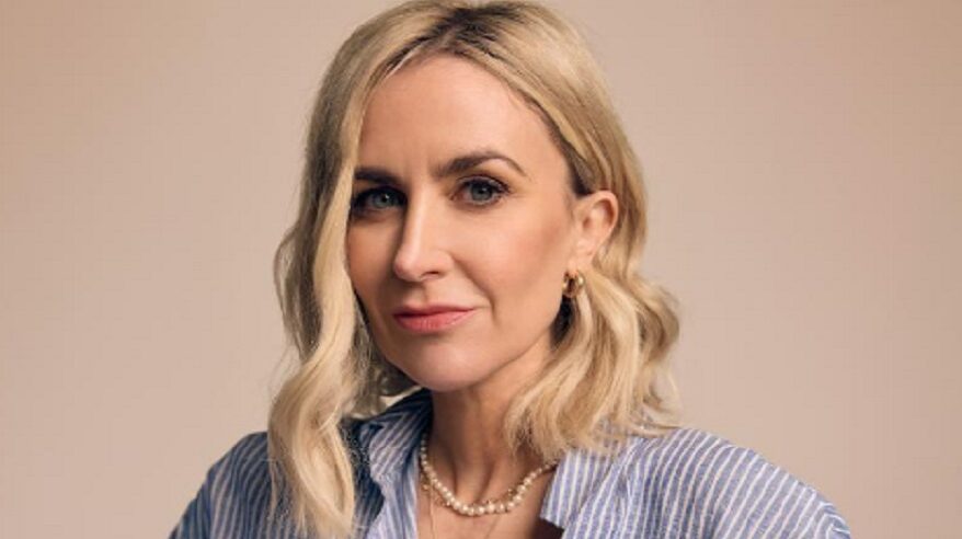 Actor Katherine Kelly in head and shoulders hot, wearing a blue and white striped shirt