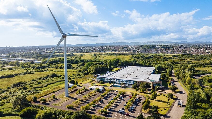 Aerial view of Great Point Seren Studios in Cardiff, including a large wind turbine in the foreground