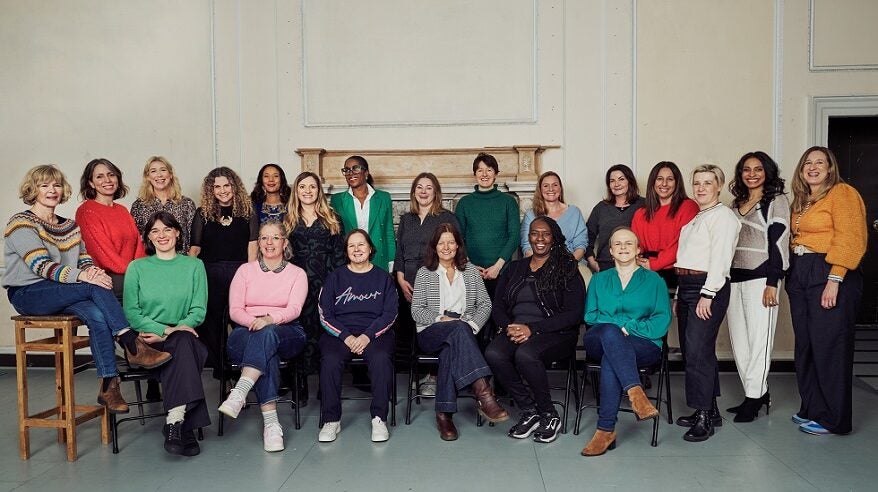 Group of 14 women, WFT cohort for Four Nations Mentoring Scheme, some standing and some seated