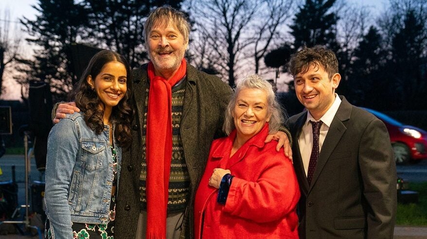 Cast of new BBC comedy Can You Keep a Secret? standing in a row with trees in the background