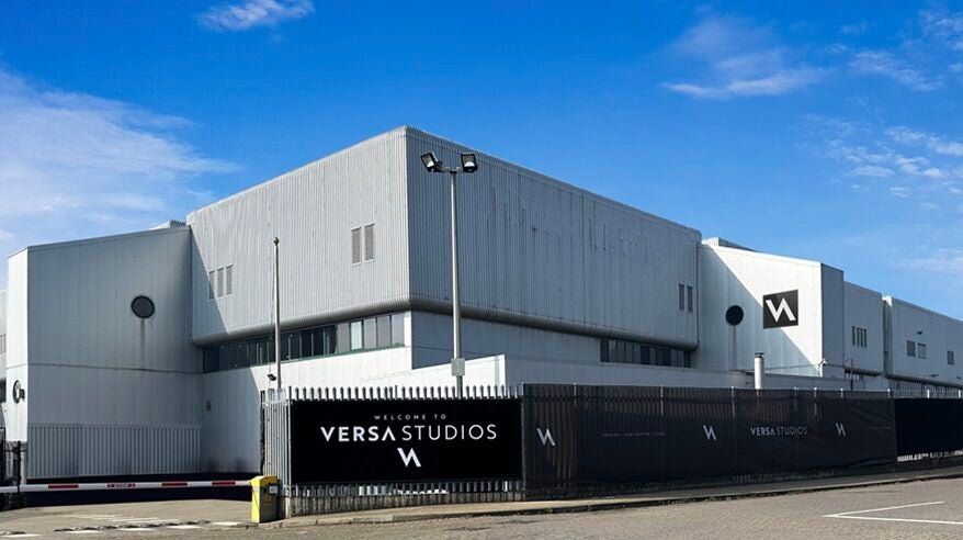 Outdoor shot of the large new Versa London Studios, against a blue sky with road in front