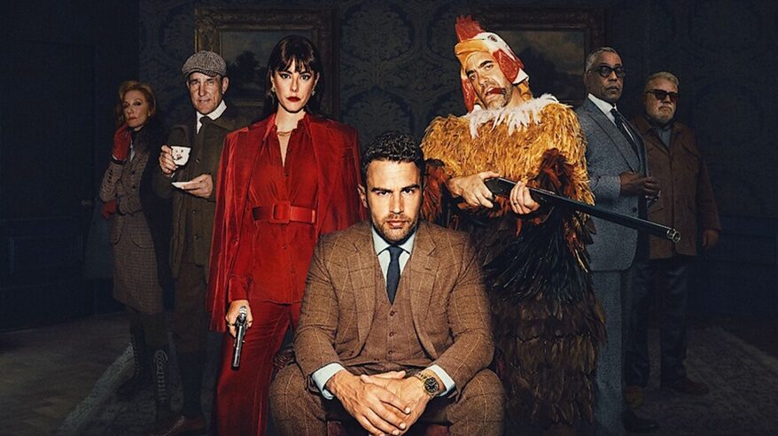 Cast of Netflix drama The Gentlemen in character, including a man in a chicken costume