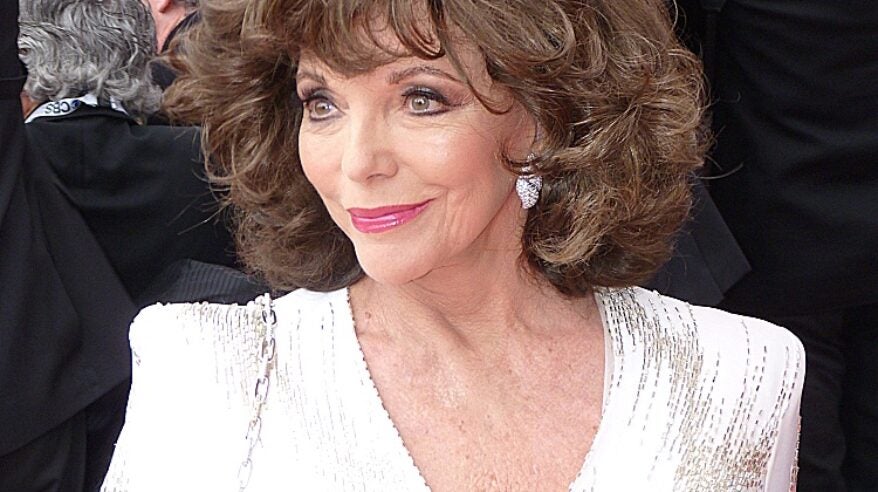 Actor Joan Collins in white sparkling jacket