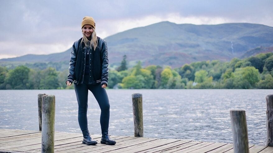 Presenter Helen Skelton standing on a decked board with the Lake District in the background