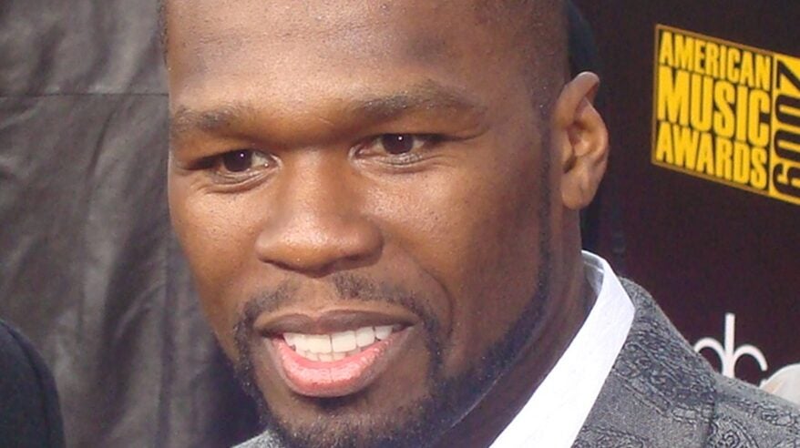Close-up of rapper and producer Curtis Jackson aka 50 Cent, wearing white shirt and grey jacket