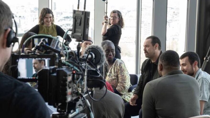 Actor Danny Dyer in a room full of interviewers and cameras in ITV show The Assembly