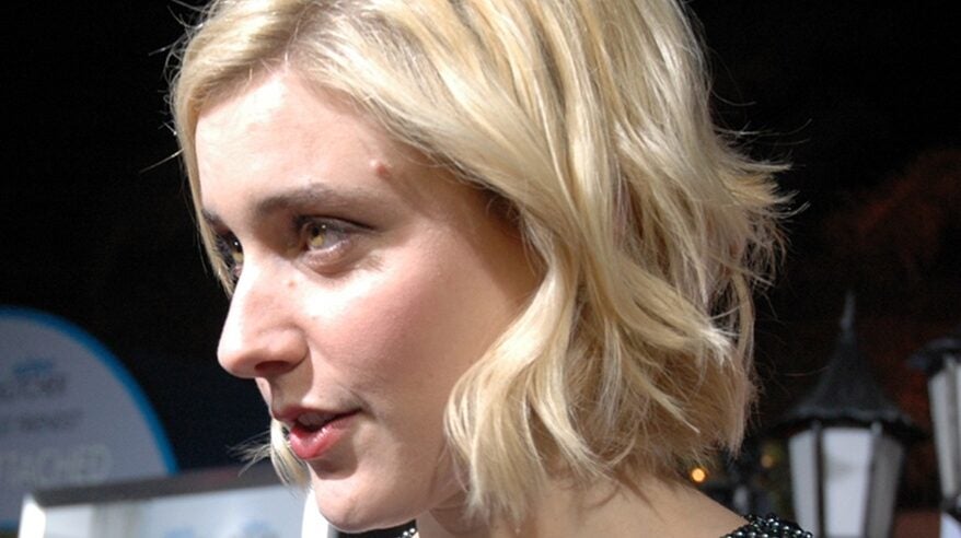 Director Greta Gerwig, cropped blonde hair, taken showing the left hand side of her face