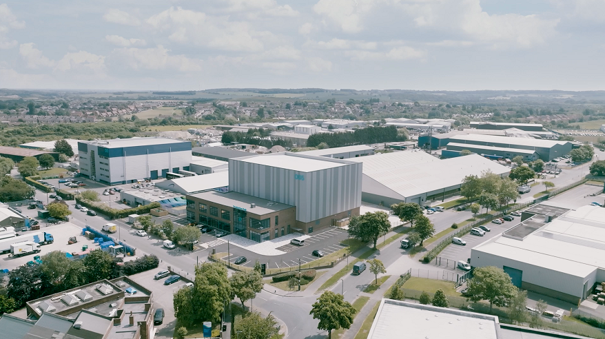 Aerial view of a film studios complex with trees in foreground